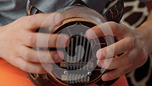 Kalimba turtle. Traditional Kalimba made from wooden board with metal, play on hands. Selective focus