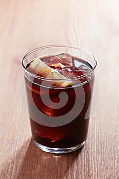 Kalimotxo glass on wooden table