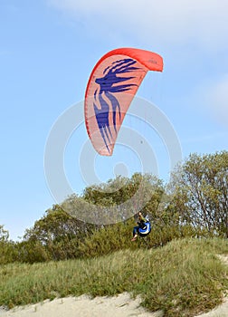 KALININGRAD REGION, RUSSIA. Flight of a paraplane in the sky over Curonian Spit