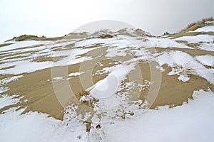 KALININGRAD REGION, RUSSIA. Snow powder on sand dunes. Curonian spit