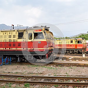 Kalka, Haryana, India May 14 2022 - Indian toy train diesel locomotive engine at Kalka railway station during the day time, Kalka