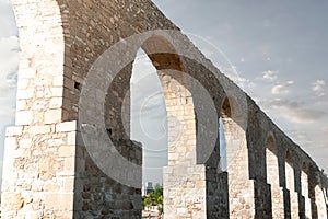 Kamares aqueduct standing tall under cloudy sky in Larnaca, Cyprus photo