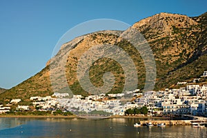 Kamares town with traditional white houses on Sifnos island on sunset. Greece