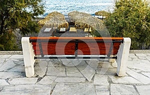 Kamari beach of Santorini covered with black pebbles, Greece Island