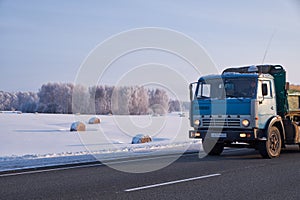 Kamaz truck on road M52 Chuysky Tract in winter season