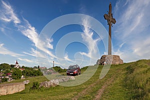 Kamianets-Podilskyi cityscape with huge metal cross, Ukraine