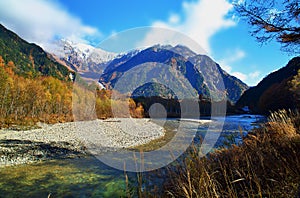 Kamikochi National Park in the Northern Japan Alps of Nagano Prefecture, Japan. Beautiful mountain in autumn leaf and Azusa river