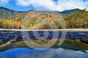 Kamikochi National Park in the Northern Japan Alps of Nagano Prefecture, Japan. Beautiful mountain in autumn leaf and Azusa river