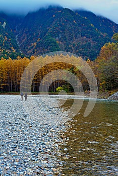 Kamikochi National Park in the Northern Japan Alps of Nagano Prefecture, Japan. Beautiful mountain in autumn leaf and Azusa river