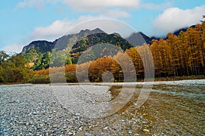 Kamikochi National Park in the Northern Japan Alps of Nagano Prefecture, Japan. Beautiful mountain in autumn leaf and Azusa river