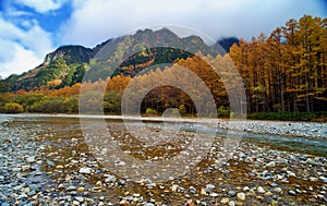 Kamikochi National Park in the Northern Japan Alps of Nagano Prefecture, Japan. Beautiful mountain in autumn leaf and Azusa river