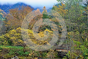 Kamikochi National Park in the Northern Japan Alps of Nagano Prefecture, Japan. Beautiful mountain in autumn leaf and Azusa river