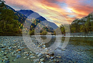 Kamikochi National Park in the Northern Japan Alps of Nagano Prefecture, Japan. Beautiful mountain in autumn leaf and Azusa river