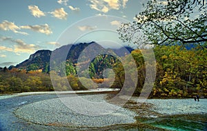 Kamikochi National Park in the Northern Japan Alps of Nagano Prefecture, Japan. Beautiful mountain in autumn leaf and Azusa river