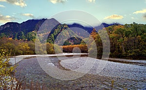 Kamikochi National Park in the Northern Japan Alps of Nagano Prefecture, Japan. Beautiful mountain in autumn leaf and Azusa river