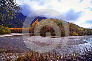 Kamikochi National Park in the Northern Japan Alps of Nagano Prefecture, Japan. Beautiful mountain in autumn leaf and Azusa river