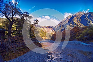 Kamikochi National Park in the Northern Japan Alps of Nagano Prefecture, Japan. Beautiful mountain in autumn leaf and Azusa river