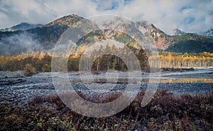 Kamikochi National Park in the Northern Japan Alps of Nagano Prefecture, Japan. Beautiful mountain in autumn leaf and Azusa river