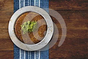 Kanafeh cheese pastry plate on table