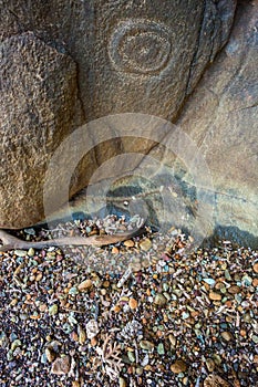 Kanak petroglyphs. Aboriginal art. Indigenous native people traditional customary ancient old rock carvings, New Caledonia.