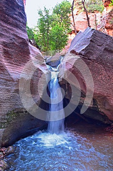 Kanarraville Falls, views from along the hiking trail of falls, stream, river, sandstone cliff formations Waterfall in Kanarra Cre