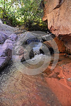 Kanarraville Falls, views from along the hiking trail of falls, stream, river, sandstone cliff formations Waterfall in Kanarra Cre