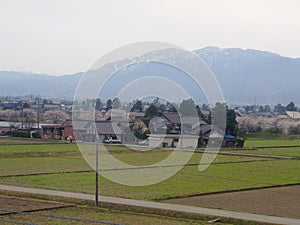 KANAZAWA, JAPAN - April 8, 2014: Farmer lifestyle: Rice fields captured from a bus in Kanazawa`s countryside