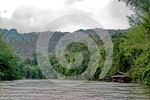 Kanchanaburi, Thailand, Apr 14 2017. Lonely Jungle Raft cabin near Kaw Noi River under mountain