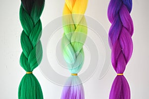 Kanekalon. Colored artificial strands of hair. Material for plaiting braids.