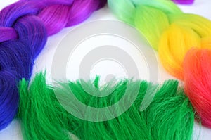 Kanekalon. Colored artificial strands of hair. Material for plaiting braids.