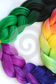 Kanekalon. Colored artificial strands of hair. Material for plaiting braids.