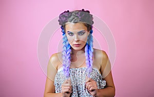 Kanekalon strand in braids. Girl with two pigtails, portrait of a fashion girl with braids. Beautiful braids. Braided