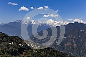 Kangchenjunga mountain with clouds above and mountain`s villages that view in the morning in Sikkim, India.