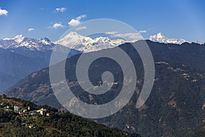 Kangchenjunga mountain with clouds above and mountain`s villages that view in the morning in Sikkim, India.