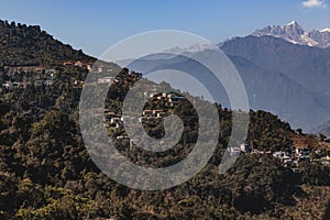 Kangchenjunga mountain with clouds above and mountain`s villages that view in the morning in Sikkim, India.