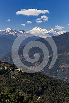 Kangchenjunga mountain with clouds above and mountain`s villages that view in the morning in Sikkim, India.