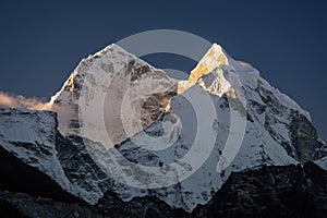 Kangtega mountain peak in a morning sunrise at Dingboche village