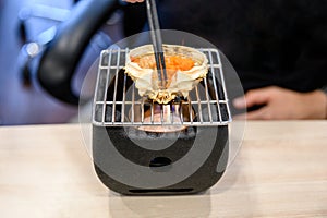 Kani miso grilling on japanese stove