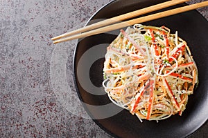 Kani salad is a Japanese style seafood salad made with crab stick closeup in the plate. Horizontal top view