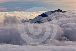 Kannongadake mountain peek above the clouds