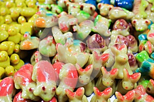 `KANOM LOOK CHOUP` is Thai desserts come in a variety of shapes and Colorful, such as fruits, animals, vegetables