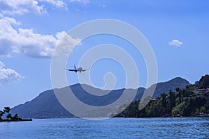 Planes taking off or landing at Kanoni,over the church of Panagia Vlacherna and the Mouse Island on the Greek Island of Corfu.