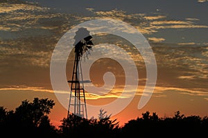 Kansas Blazing Sunset with a Windmill Silhouette and colorful sky