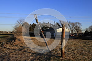 Kansas Windstorm damage with broken powerline poles in Hutchinson Kansas USA.