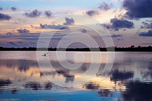 Kanu in the middle of lagoon during sunset in Utila, Honduras, Central America