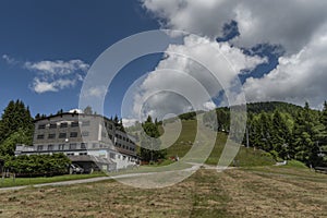 Kanzelhohe hill with cable cars and hotels in sunny fresh summer day