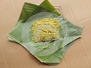 Kao Mao is name of pounded unripe rice wrapped banana leaf,Thailand dessert.