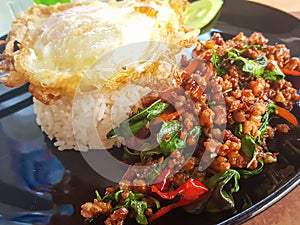 Kao Pad Kra Prao or Thai rice with pork and basil