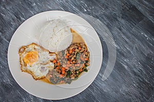 Kao Pad Kra Prao or Thai rice with pork and basil and fried egg.
