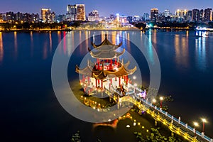 Kaohsiung`s famous tourist attractions aerial view, Beautiful decorated traditional Chinese Pagoda with Kaohsiung city in